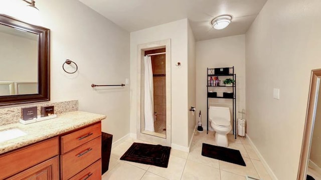 bathroom featuring tile patterned floors, vanity, toilet, and a shower with curtain