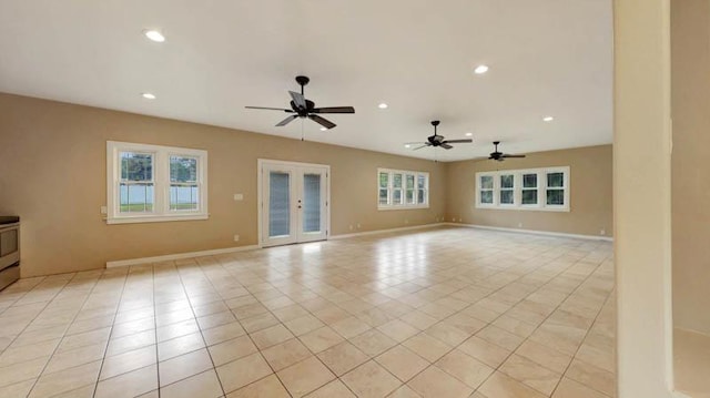 tiled spare room with french doors and ceiling fan