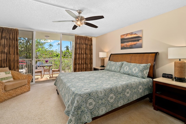 bedroom featuring floor to ceiling windows, ceiling fan, light colored carpet, a textured ceiling, and access to outside