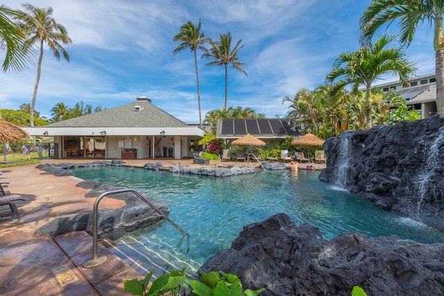 view of swimming pool featuring a patio and pool water feature