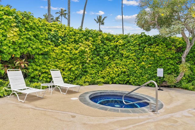 view of pool with a community hot tub