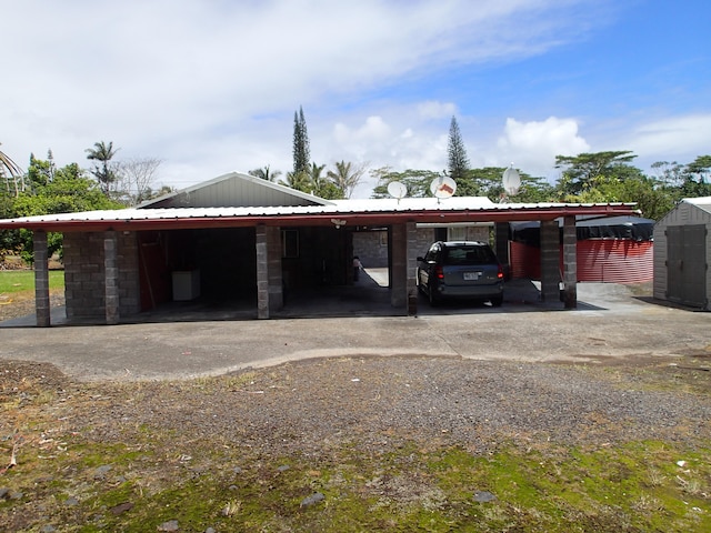 garage featuring a carport