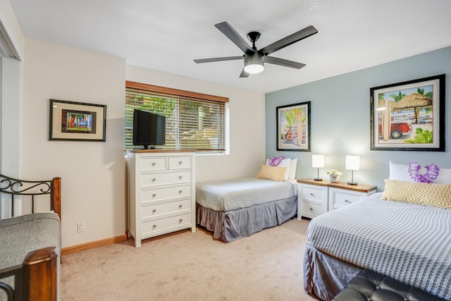 bedroom with light carpet and ceiling fan