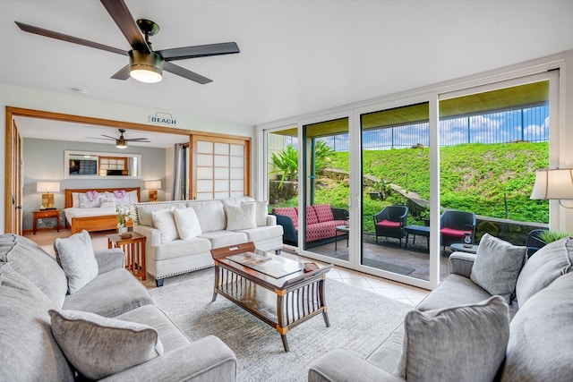 tiled living room with ceiling fan