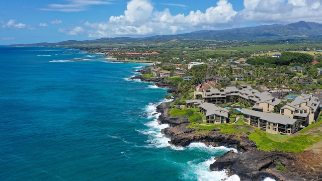 drone / aerial view with a water and mountain view