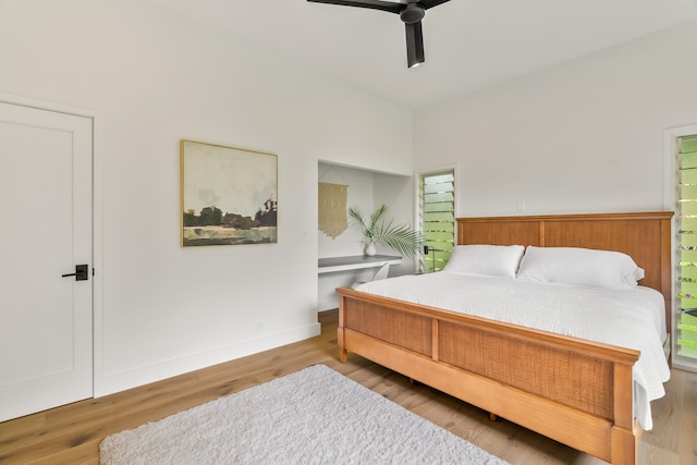 bedroom with ceiling fan and hardwood / wood-style flooring