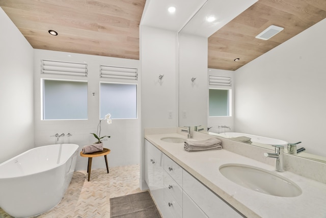 bathroom with vanity, a tub, and wooden ceiling