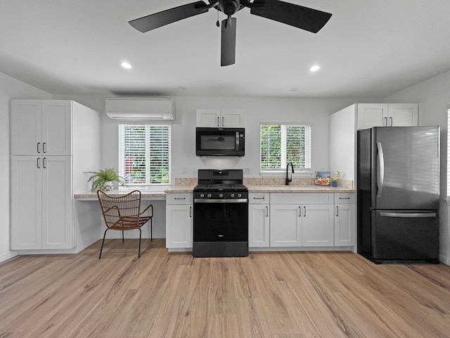 kitchen with light hardwood / wood-style flooring, fridge, white cabinets, and stove