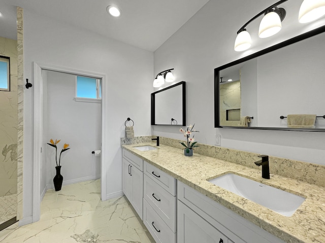 bathroom with dual vanity and tile patterned floors