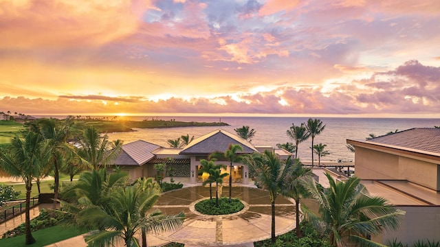 view of front of property with a water view