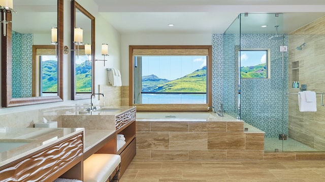 bathroom featuring tasteful backsplash, tile floors, dual vanity, and separate shower and tub