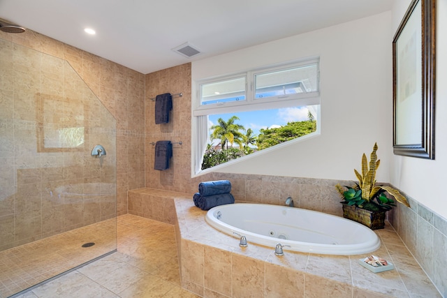 bathroom with shower with separate bathtub and tile patterned floors