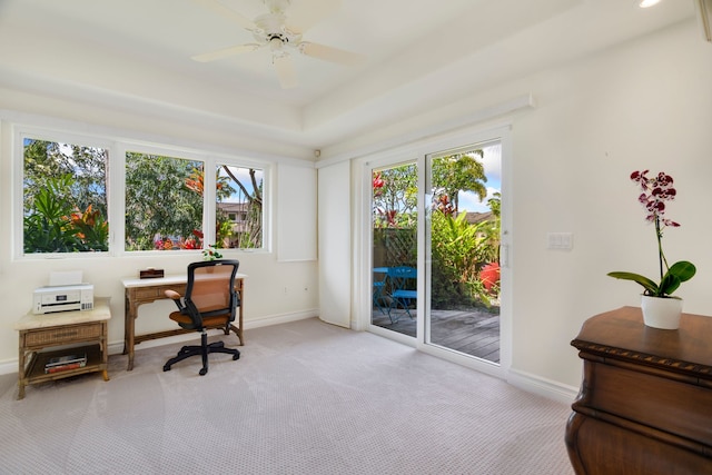 carpeted office space with ceiling fan