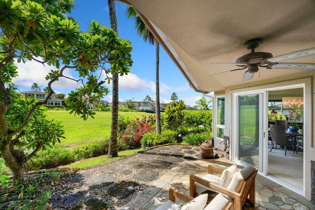 view of patio featuring ceiling fan