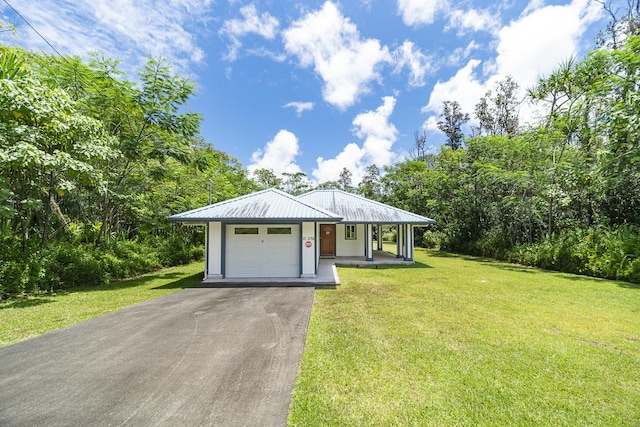 ranch-style home with covered porch, a garage, and a front lawn