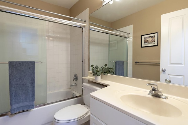 full bathroom with shower / bath combination with glass door, vanity, and toilet