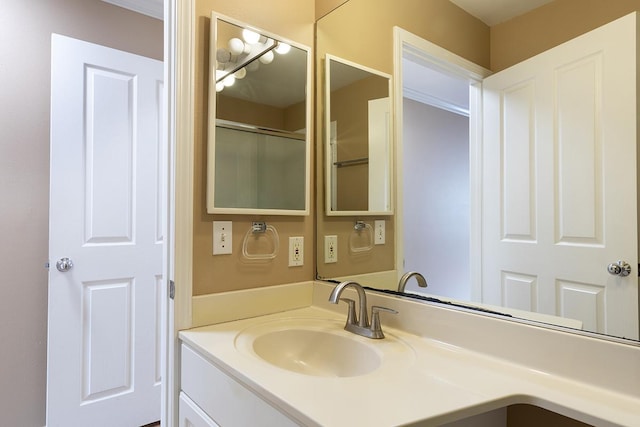 bathroom with vanity and walk in shower