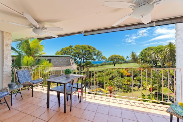 view of patio / terrace featuring ceiling fan and a balcony