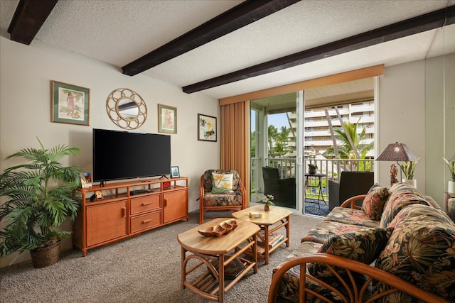 carpeted living room featuring beamed ceiling and a textured ceiling