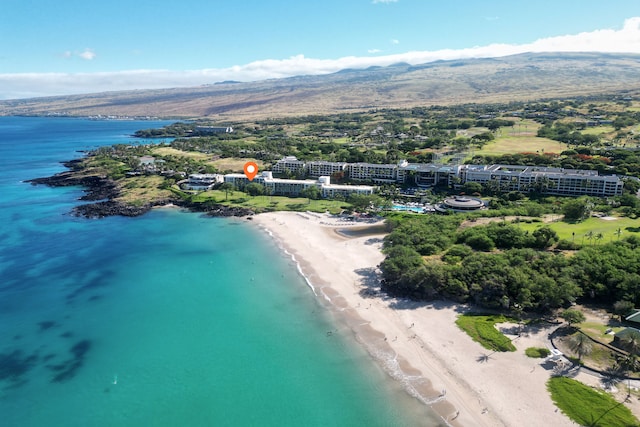 birds eye view of property featuring a beach view and a water view