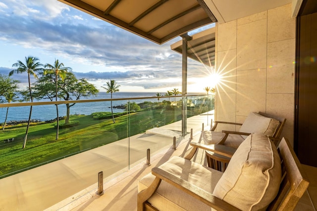 balcony featuring a water view