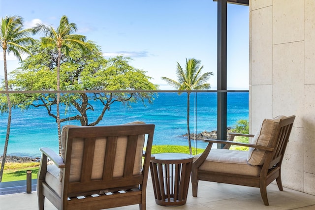 balcony featuring a water view