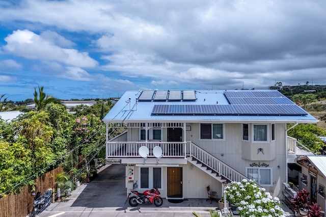 view of front of house featuring solar panels