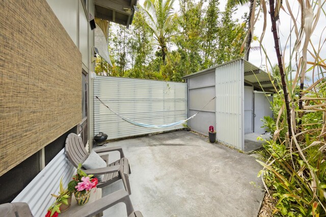 view of patio / terrace with a storage shed