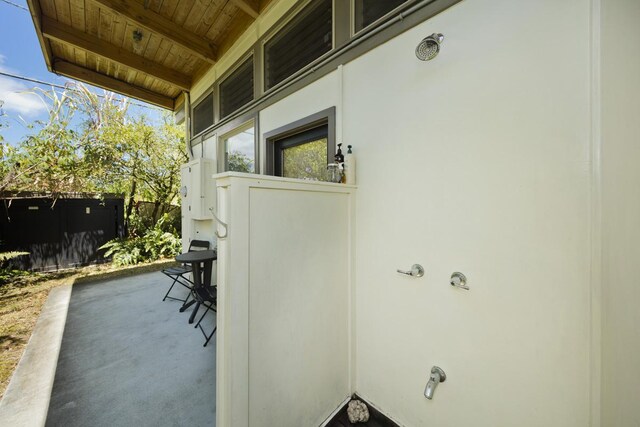 exterior space with wood ceiling and carpet