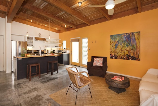 living room featuring baseboards, a ceiling fan, wood ceiling, vaulted ceiling with beams, and concrete floors