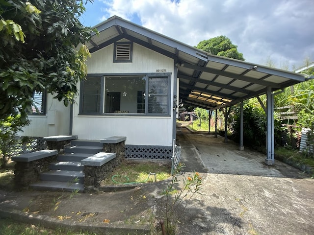 exterior space featuring a carport