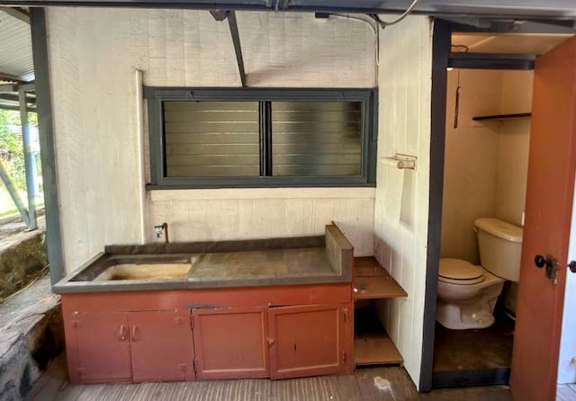 bathroom with hardwood / wood-style floors, vanity, and toilet