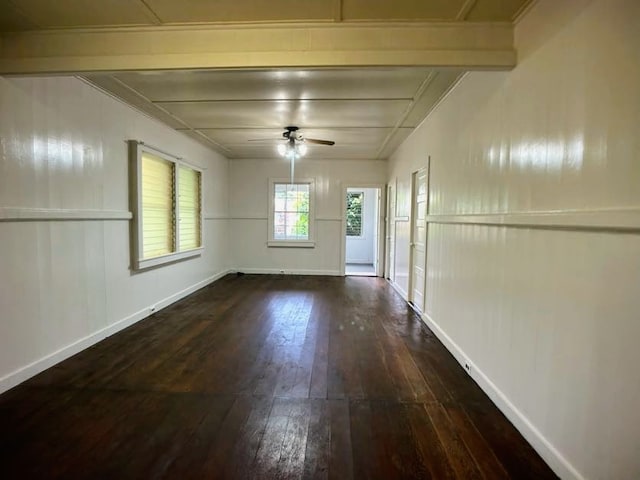 unfurnished room with ceiling fan and dark hardwood / wood-style flooring