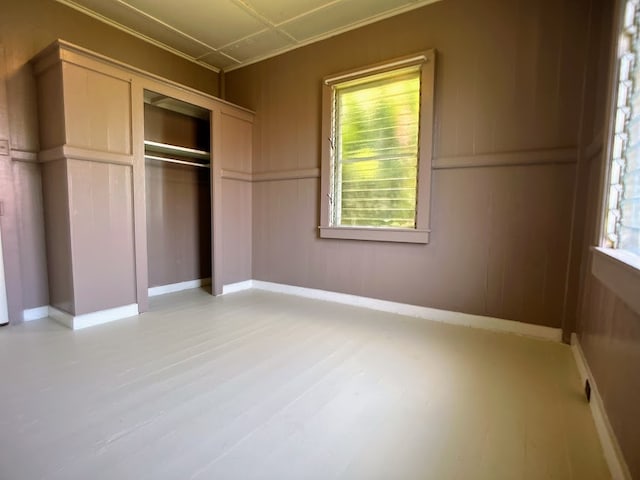 unfurnished bedroom featuring light wood-type flooring and a closet