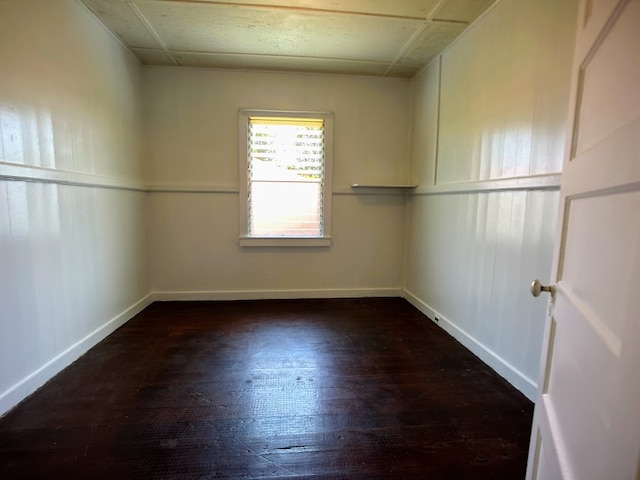 empty room featuring dark wood-type flooring