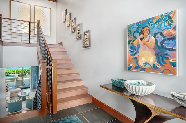 stairs featuring tile patterned flooring