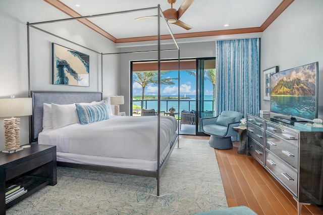 bedroom featuring ceiling fan, light hardwood / wood-style floors, and ornamental molding