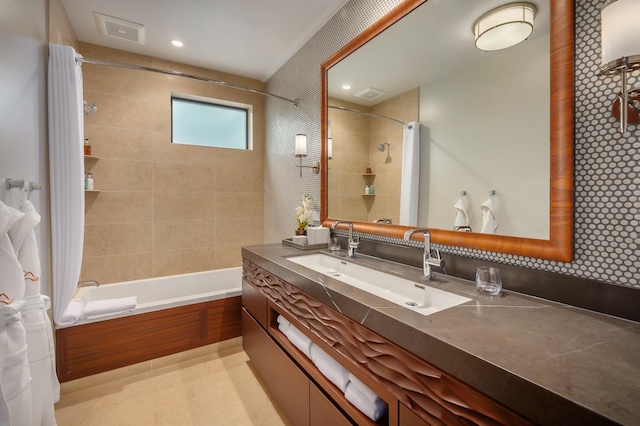 bathroom featuring shower / bath combo and vanity