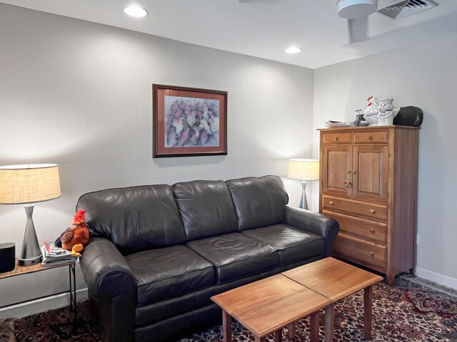 living room with hardwood / wood-style flooring and ceiling fan