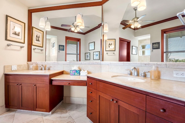 bathroom with ceiling fan, vanity, and ornamental molding