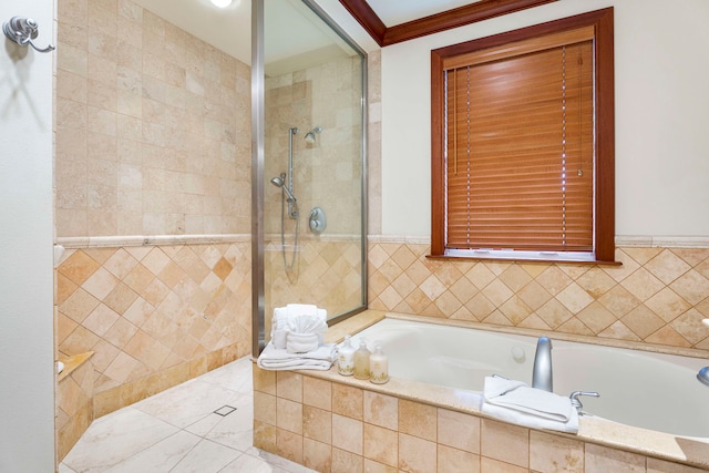 bathroom with ornamental molding, tile walls, and plus walk in shower