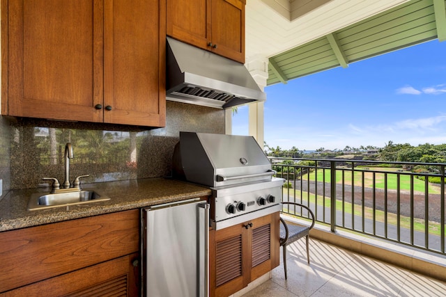 view of patio / terrace featuring a grill, a balcony, and sink