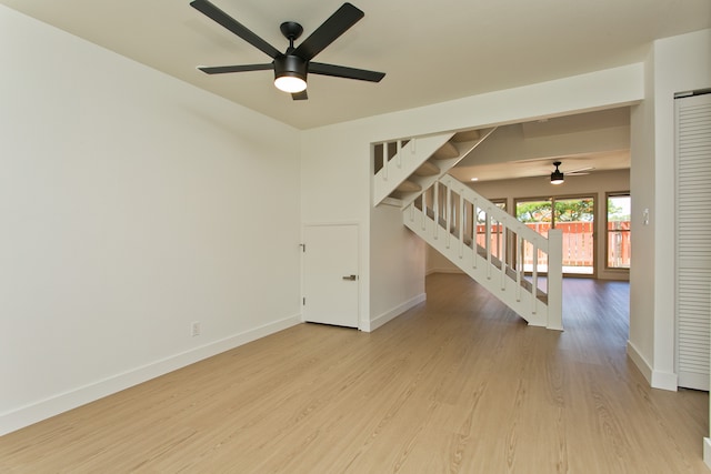 spare room featuring ceiling fan and light wood-type flooring