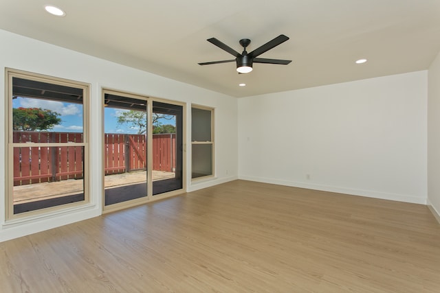 unfurnished room featuring ceiling fan and light hardwood / wood-style flooring