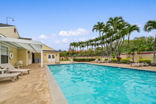 view of swimming pool with a patio