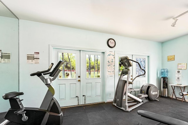 exercise room featuring french doors