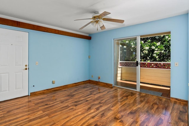 empty room with dark hardwood / wood-style floors and ceiling fan