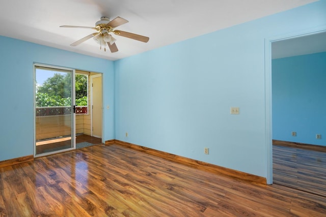 unfurnished room featuring ceiling fan and dark hardwood / wood-style floors