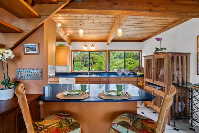 dining room featuring beamed ceiling, sink, and wood ceiling