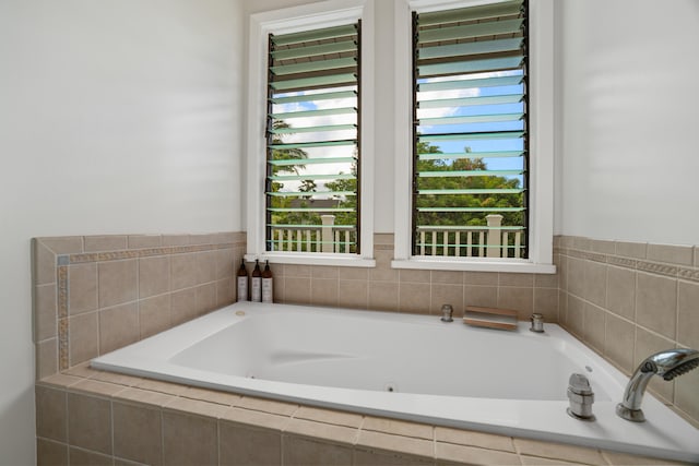 bathroom with tiled bath